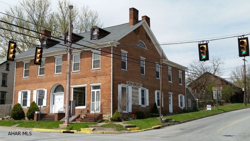 Own a part of history in Shellsburg with a highly visible location on scenic Lincoln Highway.  The route is often used by visitors to Flight 93 and Omni Bedford Springs Resort. The very popular Shawnee State Park is within walking distance. Exception circa 1800 3 story, brick building with over 6,000 sq.ft allows for a multi purpose business/residence opportunity. The structure has many exceptional updates such as new windows, kitchen, Electrolux appliances, granite countertops and heating system. 8 fireplaces, 48 original doors, hardwood floors, 2 staircases, large barn and quaint terrace are but a few of the many unique architectural features. Click on the narrated visual tour to realize the many features of this amazing building that must be seen to be appreciated.