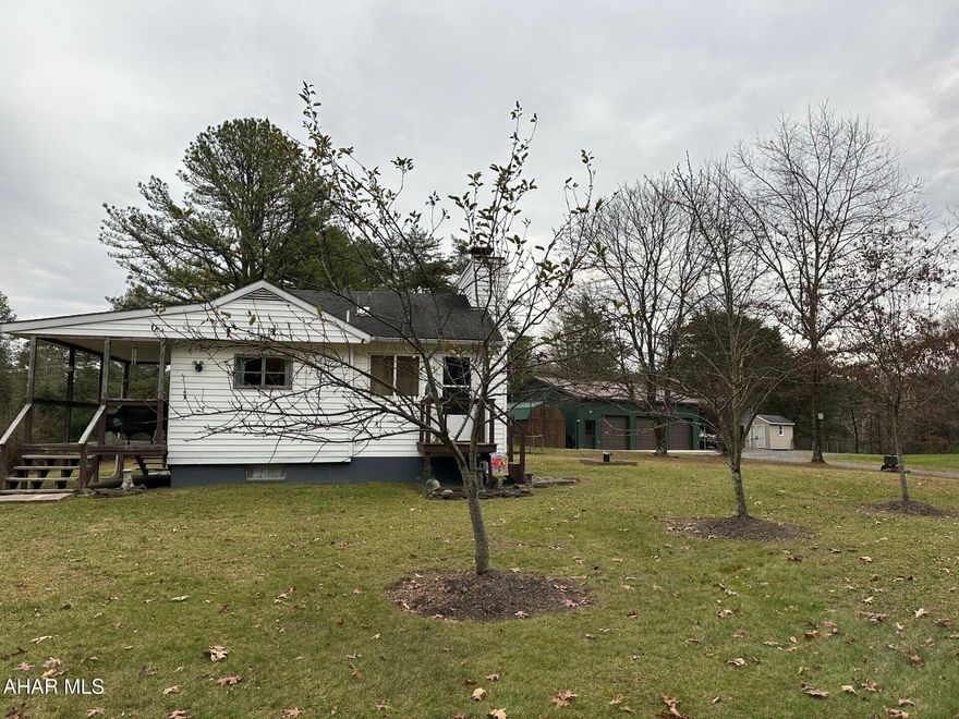 Great Weekend Getaway, Full-time Residence or a Hunting Camp! Situated between Buchanan State Forest in PA and Green Ridge State Forest in MD.
This 2 bedroom 1 bath singlewide w/addition/family room has a beautiful woodburning stone fireplace, open living/dining area. Full basement w/half bath, workbench, storage shelves and much more. Large front porch for relaxing and watching the abundance of wildlife and enjoying the  views of the mountain's.  The 30x40 3 bay garage w/electric, concrete floor, has a lift and  overhead loft for storage.  A new 20x30 carport for a large camper.  2 additional sheds a 10x8 and 10x16  with electric. Underground Utilities.