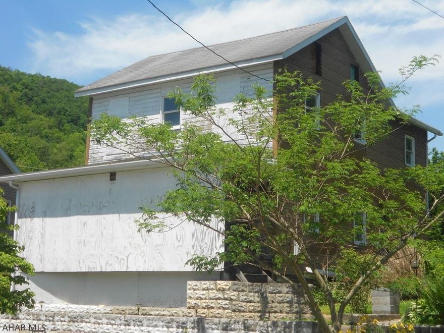 Looking for a fixer-upper or tear down? This house is it. It's mainly about the 0.208 acre parcel located in town. House does have electric, public water and public sewer hook ups. Could be salvaged or torn down for a new house.