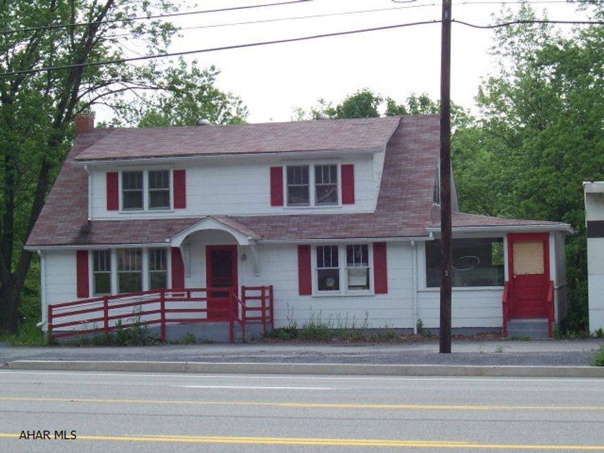 Looking to start a business and a home to live in? Commercial property/Residential. A 2 car detached garage and 2 car integral garage, new roof, 400 Amp electric service,  city water and sewer, oil forced air heat on .9130 acre.  Built in 1940. Great location and many businesses around it. Business Route 30 high traffic area. Has all the commercial permits for this property.!