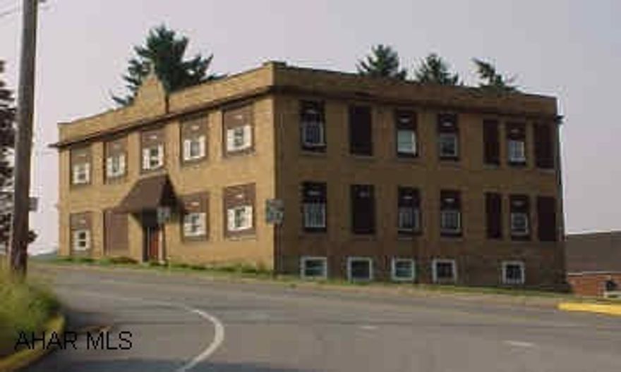 3 story, brick apartment building on Rt 36, Ashville Boro. Former schoolhouse, converted in 1980's to 7 apartments. Rental history has been good. Same ownership since 1986.  Tenants pay heat and light.