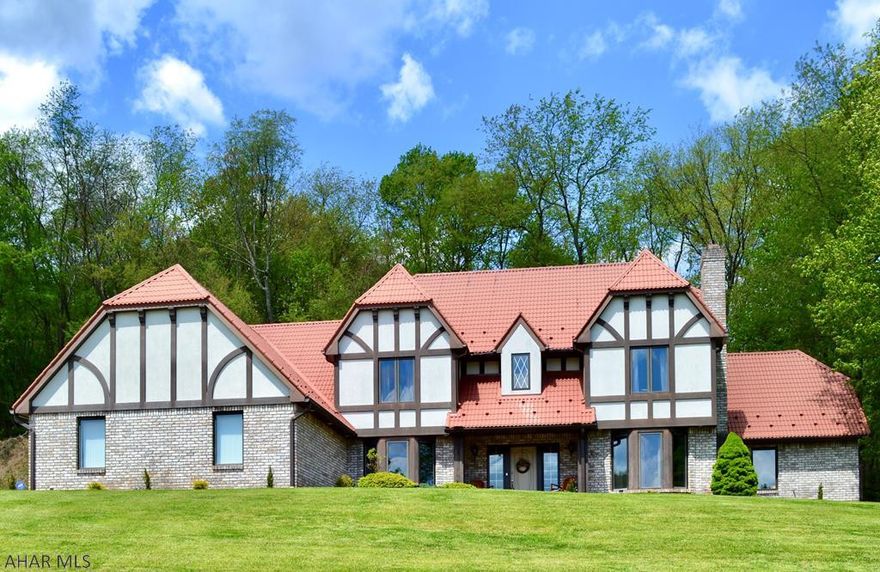 Tastefully updated, this one of a kind Tudor home located in Historic Bedford, PA is sure to impress even the most discerning buyer.   Grand foyer with exposed staircase overlooking cathedral ceiling living room with gas fireplace and built-ins.  Large kitchen with granite, island, and breakfast nook and custom fit appliances.   Separate formal dinging room and nearby study/office with gas fireplace.  First floor master suite with twin walk-in closets, custom tile shower, soaking tub and dual sinks.   Second floor boasts 3 additional bedrooms and 2 full baths, including an optional second master with en suite bath and walk-in closet.   Large outdoor paver patio, concrete driveway, 3 car attached garaged.  Smart home with ADT security, Sensi thermostats and Ring monitoring.  Call TODAY!!!