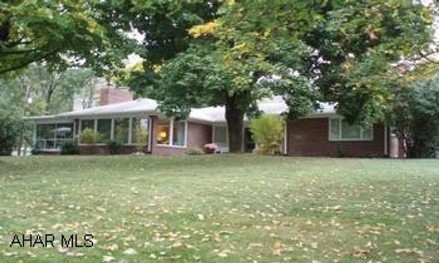 GET READY TO SPRING INTO SUMMER!   Check out this 3BR, 2.5 bath brick ranch in Meadowbrook Terrace with an attached double garage.  Enormus finished FR in basement, including a wet bar, is ideal for your next summer party.  Cozy woodburning FP in a bright & airy living room that has crown molding, charming wood shutters in most of the house.  Two BR's have built-in dressers. Bright up-dated kitchen.  Summer is hear and  the stately shade trees accent this large beautiful corner lot.  Beat the summer heat with the central air for those sultry days that are already here & the spacious screened-in porch off of the LR... for those perfect cool, quiet nights.  "Lock-in" on a new lower rate that will make your payment one of this Summers Best Buy's. Close to Bedford Schools & this home is Radon free!     Priced to move.  Call Patty Chwatek @ 814-285-0314 for your personalize tour today.