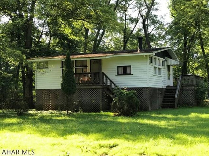 Enjoy the lazy days of summer in this cozy cottage along Dunnings Creek!  Come see this 2 bedroom, 1 bath cottage on almost 1 acre. Leave your worries behind and relax on the deck overlooking the creek!   Perfect hunting/fishing weekend getaway and minutes from I-76/I-70, Cumberland, Altoona and Johnstown.