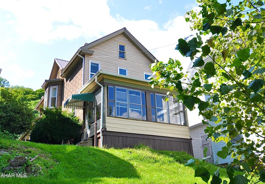 Wonderfull hillside 2 1/2 story home in great shape. Lots of off street parking in rear parking lot accessed by Jefferson Avenue.