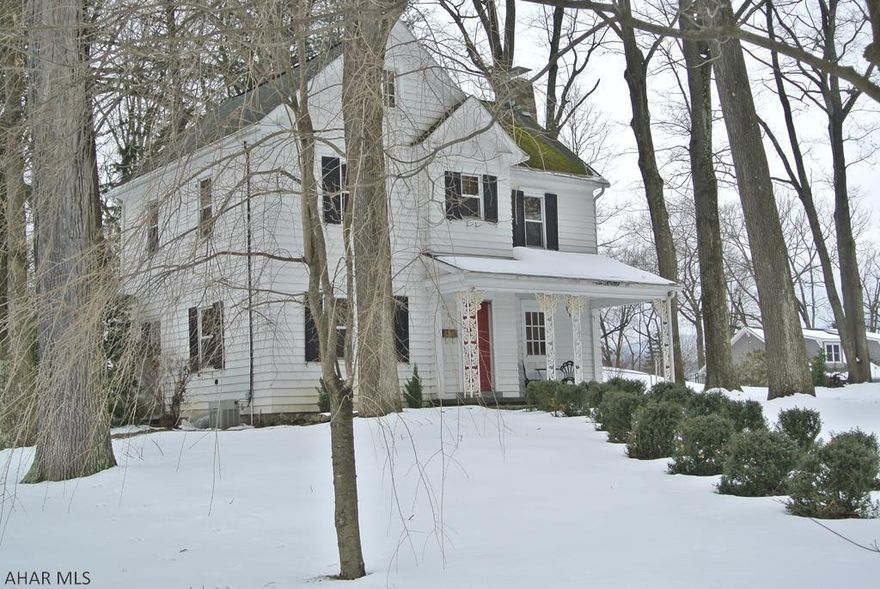 "Time almost stands still" with this darling of a home.  Such an awesome view of history!  3 floors of beautiful Hardwood floors, Spacious rooms with the classic elegant wood trim throughout.  If you love a home with the Historic character...YOU WILL LOVE THIS HOME.   The setting of this home carries the shade of old oak trees, a covered front porch for sitting, as well as a covered rear patio and a fenced yard.   The 3rd floor is finished with its own 3/4 bath and roomy enough for 2 bedroom areas...and has Central Air!. The landing provides a nice area to read on the window seat (storage underneath) and there is a cedar closet in the hallway...perfect for winter clothes storage.   This is a must see!  Make your appt today.  A Home Protection Plan is included.