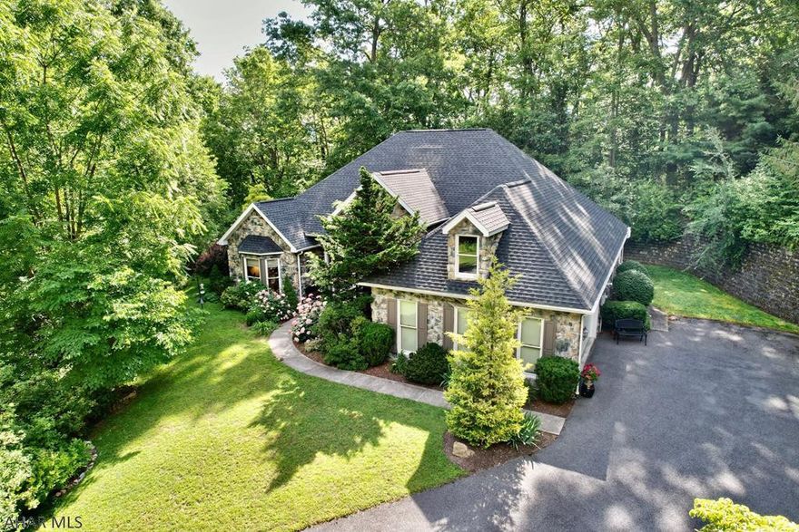 Wow...This is a spectacular one story stone home.  Everything about this house just warms the imagination. Its magnificent curb appeal, fabulous floor plan & amazing location surrounded by trees and nature within a minute of town will impress. The moment you enter, you are surrounded by nature through its many huge windows, cathedral ceilings & architectural appeal. One can imagine cooking up meals while enjoying guest & family in the open concept design. Enjoy natural gas radiant floor heat & fireplace while gazing through transom windows in every direction. A private owner's suite with two walk in closets is privately located in a separate wing of the house. New HVAC, roof, garage doors, paint, flooring, appliances & renovated bathroom and so much more.  Stunning home will not last long!