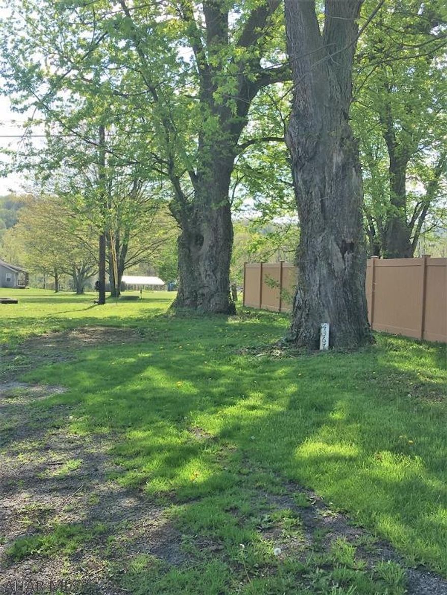 Great location for this almost 1/2 acre flat lot! Two accesses, two sewer and water taps!