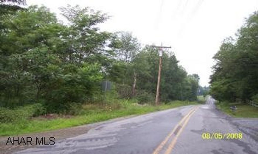 9.6 acres below lemon drop golf course on Lemon Drop Rd.  site has been approved for AB type sewage system.Back border of the property is Chest Creek.