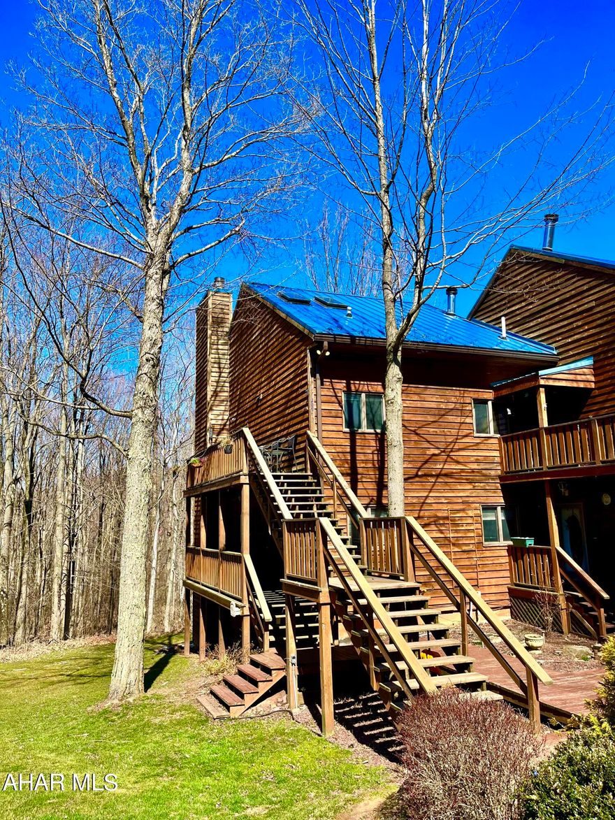 Where rustic meets elegance - Step right up into 209 Moss Creek Drive, where you'll feel immediate relaxation and content in the heart of the mountains. This well-maintained condo is looking for its next owner! Whether you are looking for a full time living space or a cozy vacation retreat, this has everything to suit your needs! This is a 2BR, 2 full bath home featuring immaculate stone floor-to-ceiling wood burning fireplace, updated flooring throughout, solarium with baby grand piano that is perfect for all seasons with panoramic views of forestry and wildlife, and separate dining space just off the kitchen. The open floor plan of this entire space offers many possibilities of how you could make it your own. Plenty of storage throughout as well! The main bedroom is very inviting with solid oak french doors and stone based garden tub. This location is close to major highways, minutes from desirable Blue Knob State Park, and perfectly situated between Bedford and Altoona. Close to shopping, but away from the hustle and bustle. This condo also features two 1-car garages as an added bonus for extra storage and parking. HOA fees include: Water, Sewer, Trash, Outside Maintenance, & Outdoor Power.
The mountains are calling and you must go!