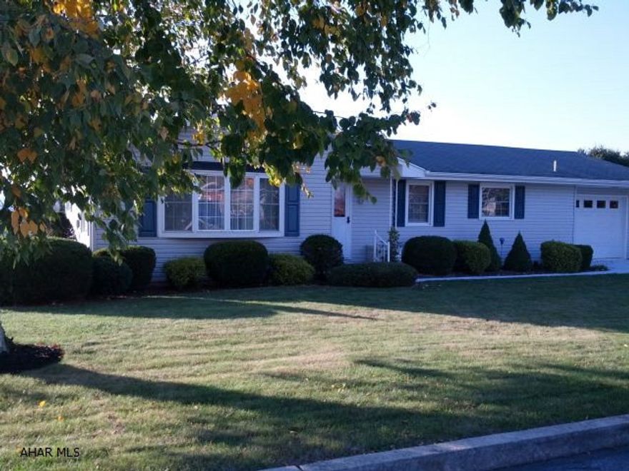 Immaculate 1-story, 3 bedroom home on the outskirts of town.  Nice hardwood floors, newer windows, Family room with woodburner and workshop in basement, back screened-in sunroom.  Laundry hookup on both main level and basement.  J-218