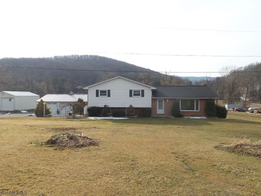 SPACE!!!  This 5-6 bedroom multi-level features 2 master suites!  Updated kitchen and baths, 2 fireplaces, screened sun room, above ground pool and 3 car garage!  All on 2.26 acres!  The house features a huge living room with a large brick wall fireplace and an enormous picture window for an abundance of natural light.  The formal dining room opens to a deck that overlooks the huge back yard.  Each bedroom is spacious and each offers ample closet space.  The lower level family room opens to a screened porch.  Enjoy entertaining in all year round with all that this home has to offer!