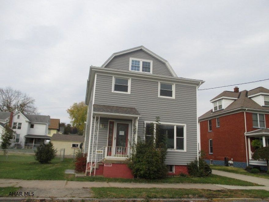 Large Tyrone 2 Story vinyl home with large, level lot and 2 car garage. Spacious living room, formal dining, first floor laundry and half bath. Needs TLC, but could be a real gem. AS-IS sale. Seller will make no repairs.