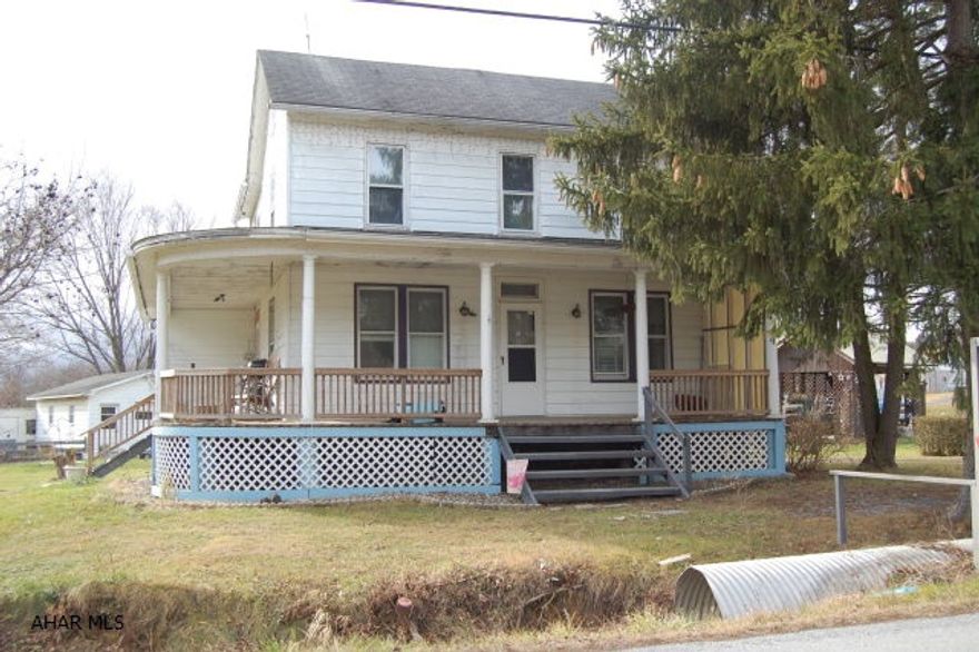 This 2 story house, located in Fishertown, would be a great starter home.  It is situated on .659 acres and is conveniently located close to schools and easy access to Rt. 56 and I99.  It features 4 bedrooms, 1.5 baths, kitchen, dining room, living room, bonus room, wrap around front porch, and large one car garage with walk out door - 26 x 17.  It has endless possibilities.  Motivated seller! Schedule your appointment today!