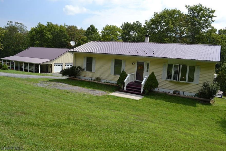 Nice raised ranch with 3 bedrooms and bath on main level with bedroom, full bath, laundry and family room down stairs. Home has an integral garage as well as a VERY large dream garage. 3 garage doors with TONS of space to do anything from gaming building to a full mechanic or repair shop.  Large RV pole building with full plumbing and electrical. The grounds are beautiful too.