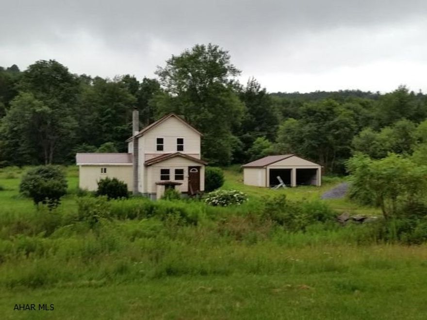 Kitchens and baths have been updated - add the kitchen sink and you have a great kitchen. New carpets and laminate flooring and new 2-car garage. Peaceful setting, 2.2 acres. Check with your bank about a construction loan...This home has great potential. Seller is selling AS IS.  #J-298