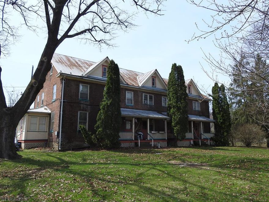 Own a piece of history! All brick 4-unit in Alexandria Borough on 1/2 acre lot. Live in the large, 3 BR, 2 bath unit and enjoy the rental income from the other 3 units. All utilities separate and paid by tenants except water/sewer. Off-street parking.