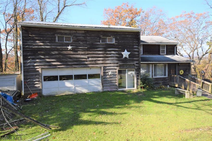 Unique fixer-upper with a separate one bedroom, one bath apartment.  Two car garage.