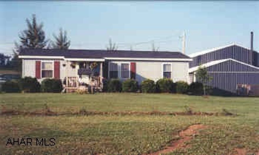 1993 24X44 three bedroom, two full baths doublewide on 1 Acre.  40X60 insulated garage