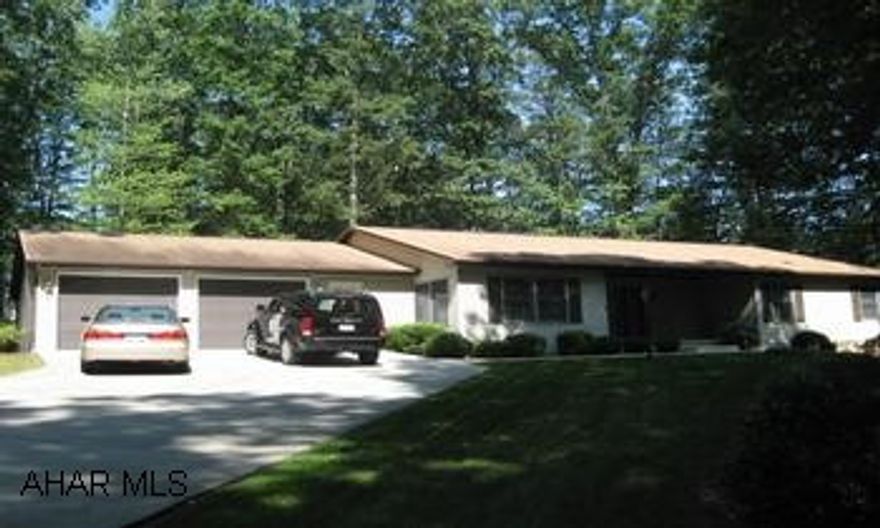 Located on a dead end street near Tyrone Hospital, wooded, private setting.  Maintenance free. Home has .836 Acre and may offer second home site.  It offers an oversized garage (847 Sq.Ft).Finished Basement. This home is located on a dead end street near Tyrone Hospital, wooded, private setting.  This home is maintenance free and a "must see". Home has .836 acre and may offer second home site.  Very nice oversized garage (847 Sq. Ft).  Finished basement with family room, 2 bedrooms, and 1/2 bath.  Range, refrigerator, washer, dryer all included.  This home was built by Lifestyle Homes in 1996.