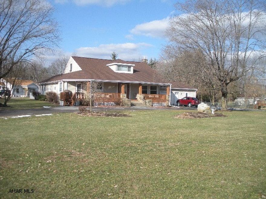 Great Cape Cod on large corner lot.  3-4 bedrooms, 2 baths, large playroom or family room, stone fireplace, updated kitchen and 1st floor laundry.  Vinyl siding, vinyl windows, central A/C, oversized garage, covered porch, fenced and landscaped yard.