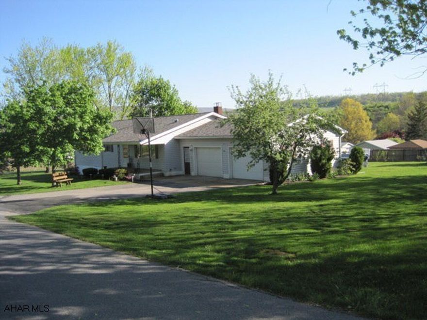 Hollidaysburg/Frankstown. One story living with all the upgrades. Beautiful kitchen and dining room with rear sunroom over looking pool area. Master bedroom with bath and large living room. Finished lower level featuring rec room with wood stove, bedroom or den area and tons of storage. All on a large corner lot.