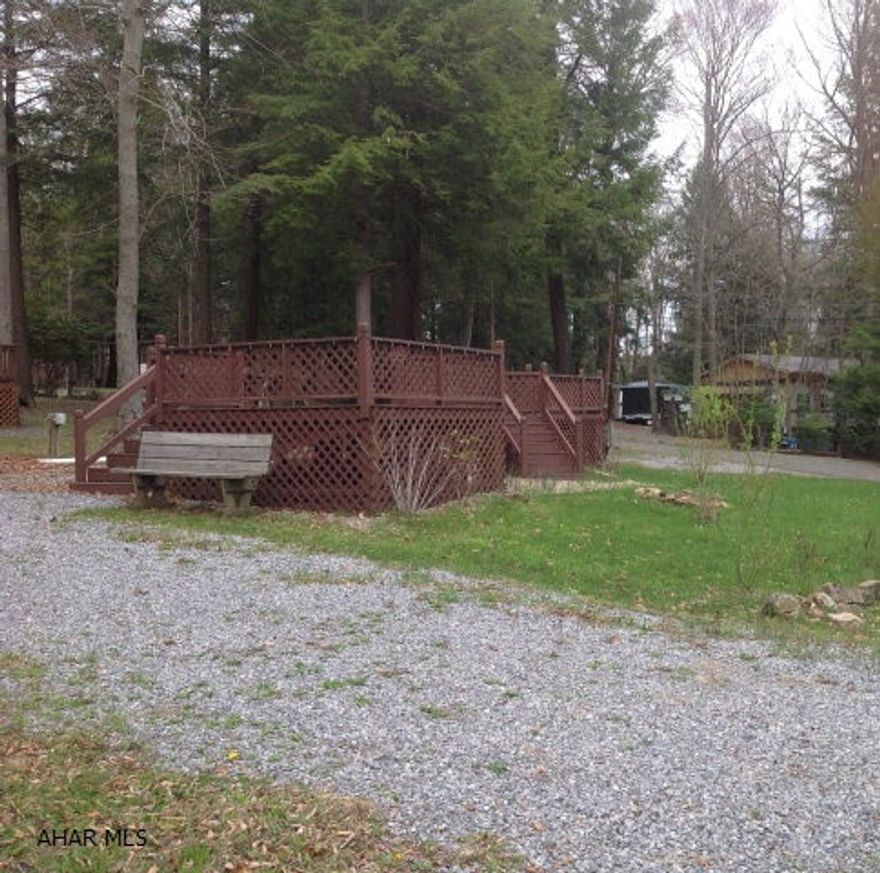 Great corner lot already set up with deck and shed.  Electricity is run to the shed.  Located in Glendale Yearound, a gated community adjacent to Glendale Lake, Prince Gallitzin State Park. About six miles from Rock Run ATV Park.