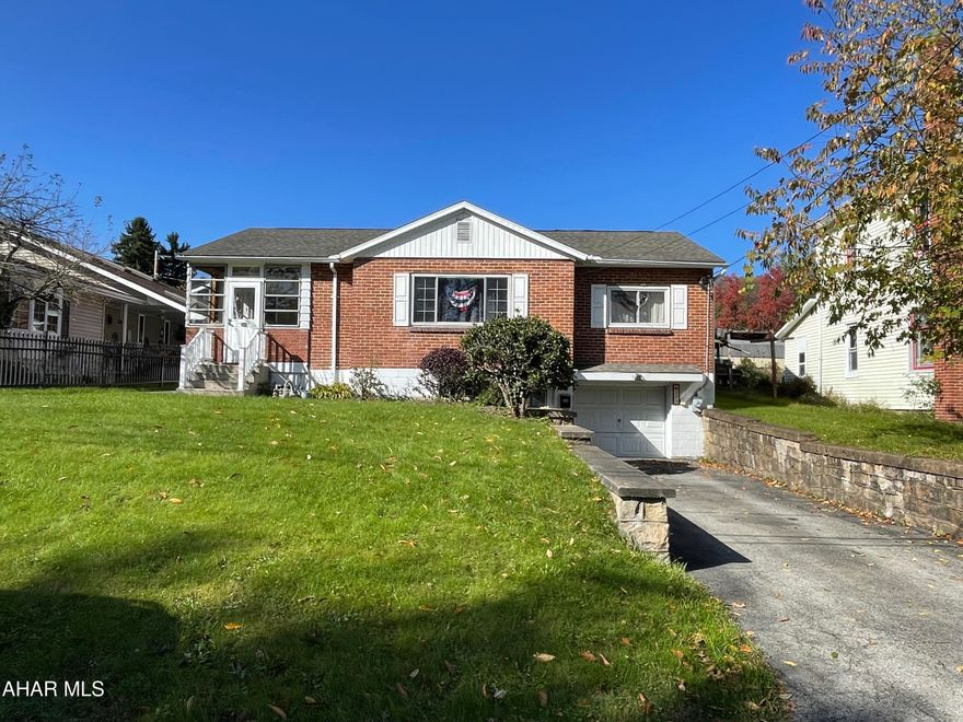 This solid 3 bedroom 1 bath home is larger than it looks and would make a great starter home. Step inside the mudroom the perfect place for coats and shoes.  The large picture window lets natural light into the living room that features hardwood flooring. Connected to the living room is the dining room that flows directly into the kitchen. There are plenty of cabinets for storage in this kitchen.  Back the hallway are all 3 bedrooms and the bathroom. There is a bonus room in the basement along with the utility/laundry room, oil tank room and integral garage. Plenty of storage in this home. Additional parking could be made in the back.  Newer furnace and radon system already installed.  Call today to schedule your showing.
