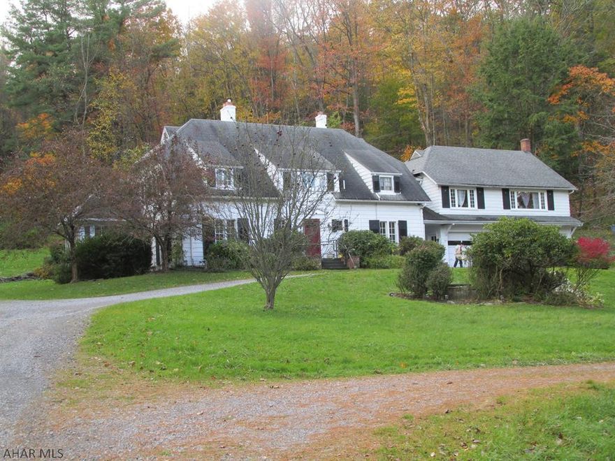 Beautiful Estate on 5.56AC lg main house is a 4BR 5BA home with a separate income producing apartment (Mother in Law suite) over Triple Bay Garage w/LR, Kit, MBA, BR, BA, 3rd flr storage/3rd BR & Separate Septic. Main house: Distinguished Center Hall Colonial w/8 pairs of French Doors, LR, DR, Sunroom/FR (passive solar addition), Kit (Cherry Cab/Quartz) Mudroom & Laundry. Property is heated by Oil Hot Water tank, oil tanks in basement and garage, public water, on lot septic, brick patio, landscape architect planned gardens, shed, cedar closet, wine cellar, wood burner, outdoor basketball court. (Some vinyl siding, mostly wood siding.) Some mini split units for Air. Birds & Wildlife common sight.