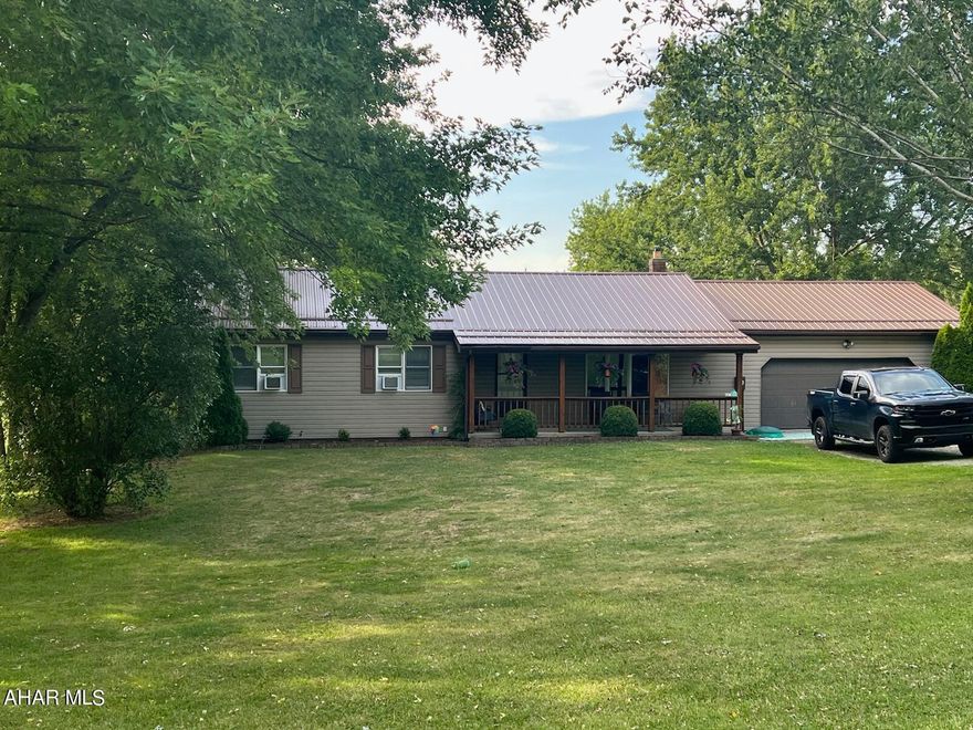 Lovely Ranch home on 2 acres bordering Prince Gallitzin state park. This home features 3 bedrooms, eat in kitchen with great view out of the sliding glass door, large living room, and bath. Basement has a game room with separate flue for wood burner, office, 3/4 bath and summer kitchen. Front porch and large rear deck partially covered. Great home for the $$.