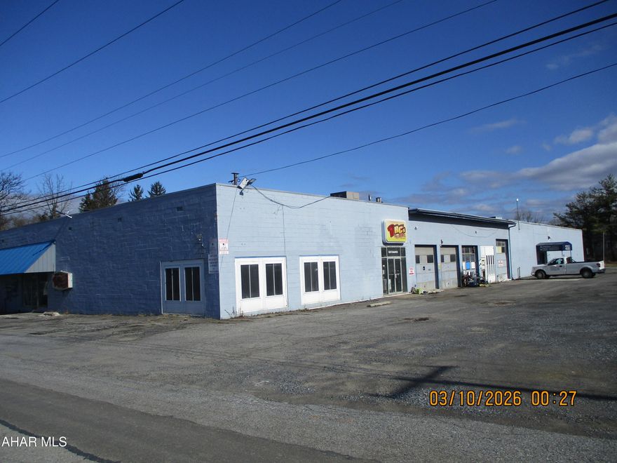 Spacious commercial site located near two major highways!  Over two level acres provides abundant parking for your business or investment interests.  The building is concrete block construction and includes a total of 23610 sq. feet of space.   Two current tenants will vacate prior to a closing.   Separate gas, electric and water meters allow for tenant paid utilities.