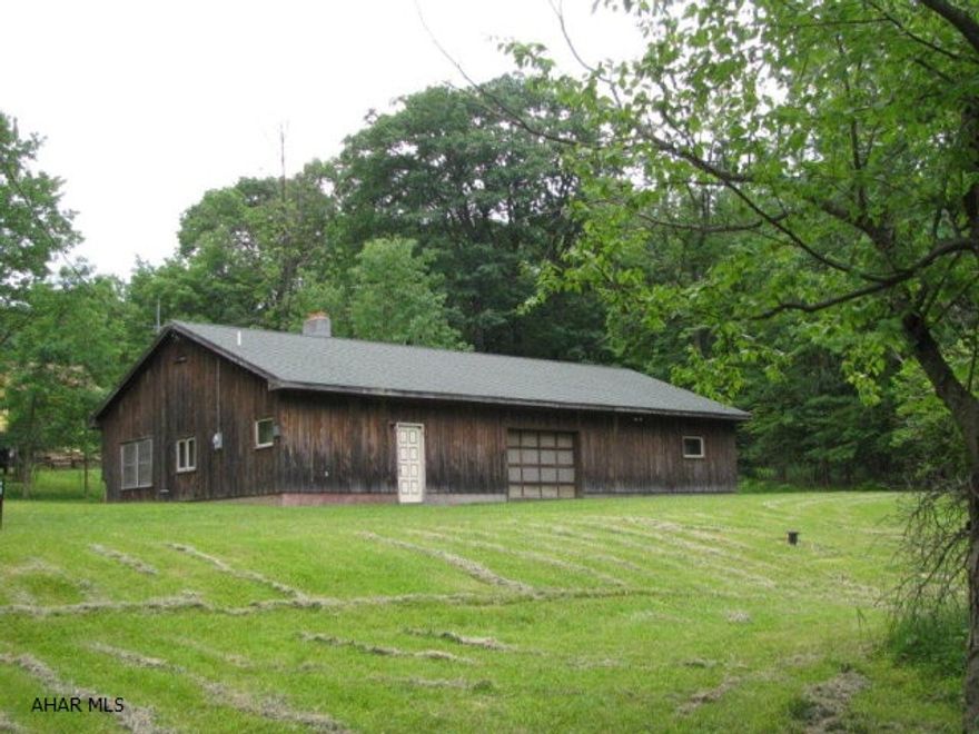 Almost 5 acres of level partially cleared ground to build your dream home! Well, septic, and electric on site. 60x32 ft garage/storage building on site. Great opportunity for hunting camp or site for large gatherings