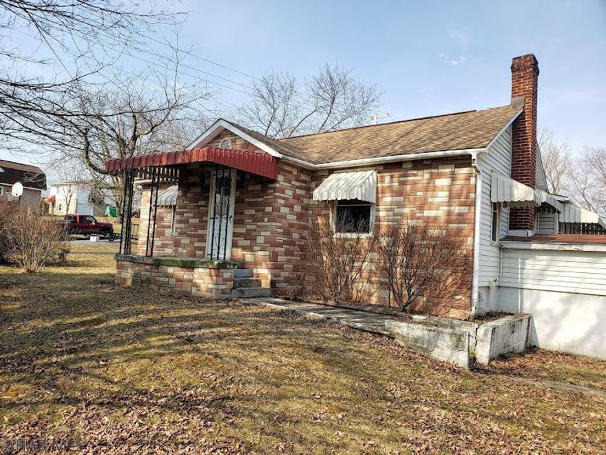 One story living, large secluded lot, new 3+ car garage (2020), green house and convenient location is waiting for you. This two bedroom, 1 bathroom home has all new thermopane windows, remodeled kitchen and bathroom, lots of space for growing a garden and harvesting grapes from the arbor. Mature trees in the front and privacy fence in the back make this home especially appealing. In addition, the ground floor bonus space could be for commercial use. Don't miss the potential for convenient, country living.