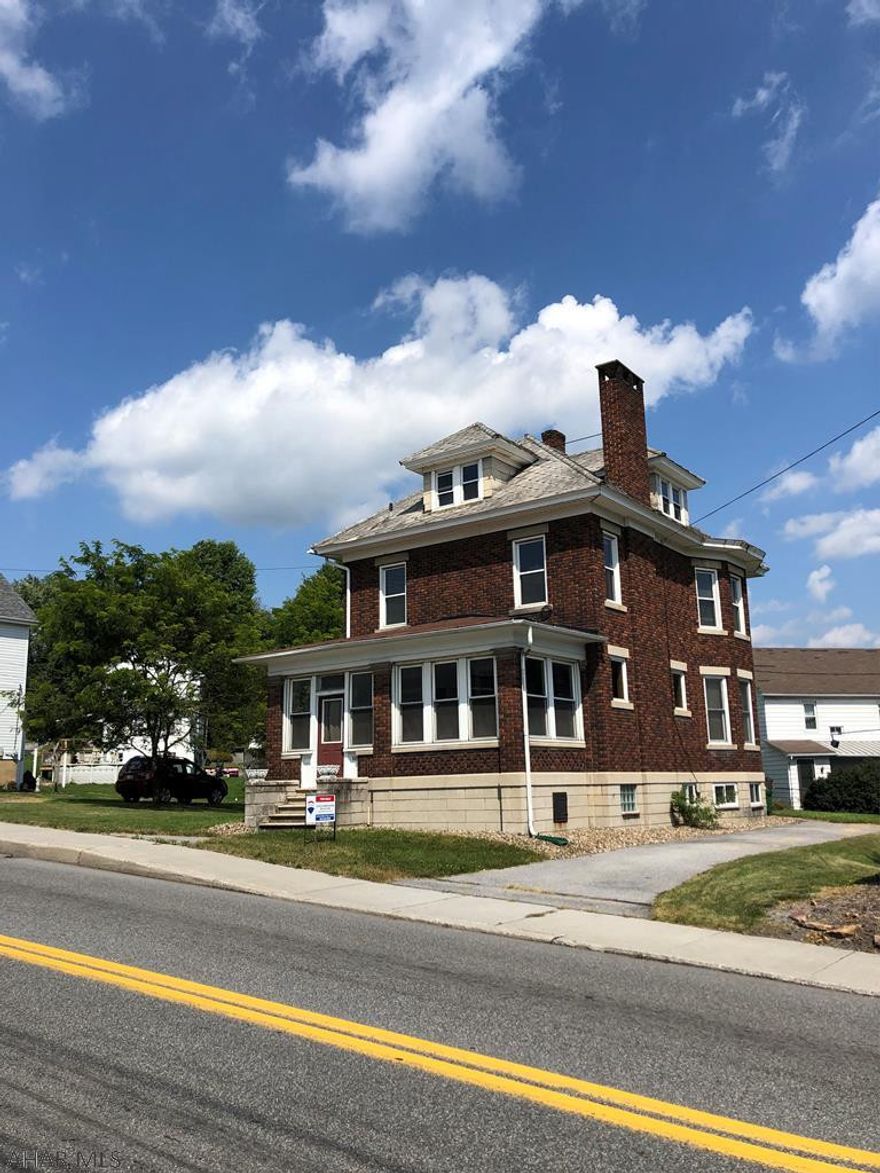 Large brick home in Ebensburg Borough! This 2.5 story home has 3 bedrooms and 2 baths. Hang your coats the in the mud room/sunroom, enter the home in the large foyer. Beautiful hard wood flooring and original wood work throughout first floor of the home. Large living and dining room has a beautiful wood burning fireplace, just cleaned, new chimney cap installed ready for winter. The kitchen has an island for meal prep and large butlers pantry with an additional working sink. Spacious bedrooms two of them have large walk in closets. Looking for additional living space the attic makes a great play/workout/family room. Newer windows, new kitchen counter, new roof on front porch, new hot water heater, new electrical in basement, seller will escrow funds to pay sewer replacement. Call today!