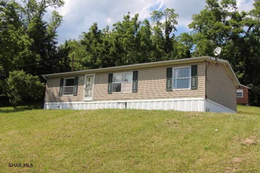 1997 Skyline Corp Doublewide on just shy of an acre with a great view in Carson Valley. Central air, 3 bedroom, 2 full bath and large detached 2 car garage in the Hollidaysburg Area School District. Schedule your showing today!