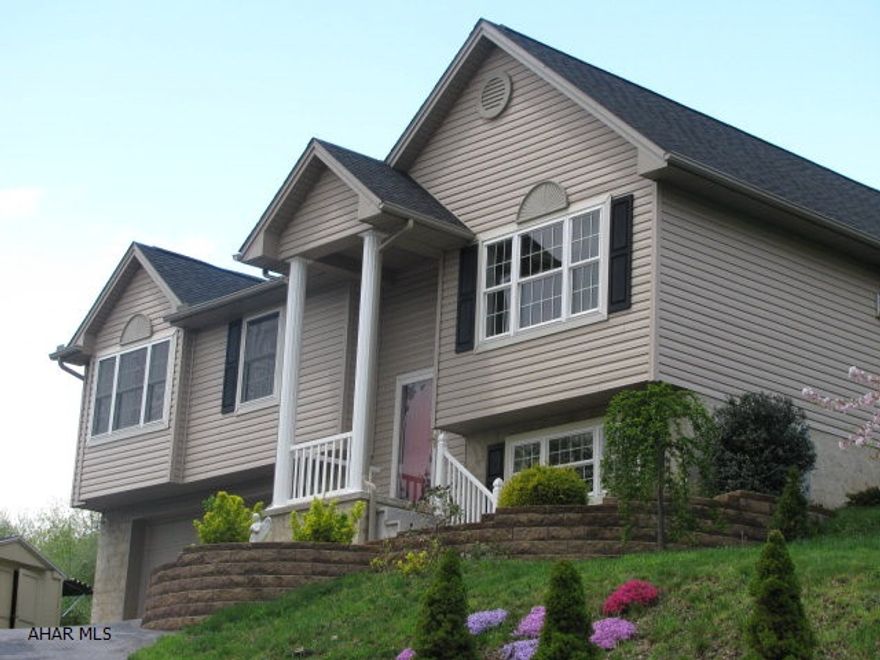 Immaculate 5 year old bi-level on 1 acre, Bellwood schools, LR., w/ gas fireplace, EIK., w/ oak cabinets, and hardwood floors, 3 Br., 3 baths, family room, covered deck, landscaped lot, central air