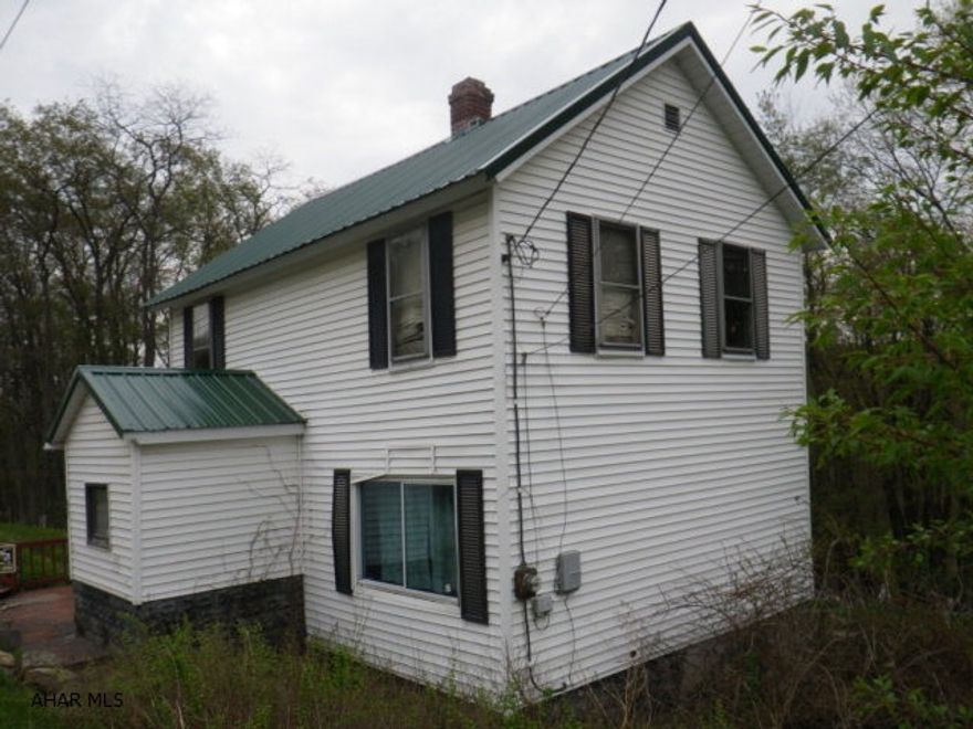 Huge lot with public water & sewage. House has a newer roof & can be salvaged & made livable.Handyman special.