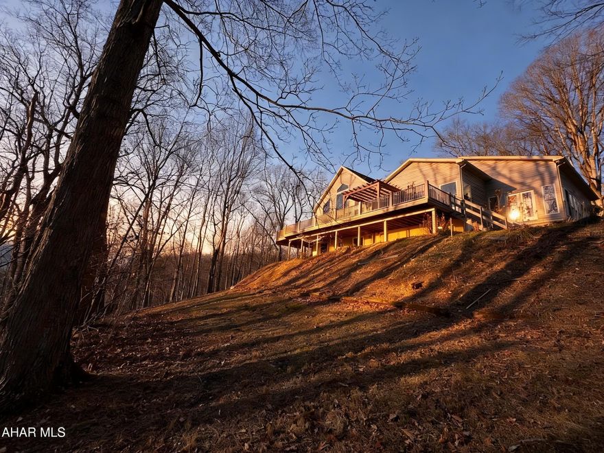 Are you looking for a private retreat? Check out this beautiful property adjacent to the American Legion Country Club in Mount Union. This quality home has a great layout with an open living area. The main living area has a living room with vaulted ceilings and a wall of windows letting in lots of natural light, and an open stairway to the second floor. The kitchen features lots of cabinet space with a walk-in pantry, island and bar area, the huge composite deck can be accessed from the living room or dining area making this the perfect spot for entertaining, the deck has a wonderful view of the river when the leaves are off the trees and lots of privacy all summer long, there is a sunroom off the kitchen, the owner suite has a large walk-in closet and full bath, the upper level offers two bedrooms with a full bath and a bonus room that could be used for an office or nursery, the lower level has two additional bedrooms with a full bath, the bedrooms all have nice sized closets, the basement opens at ground level and is mostly finished with the unfinished areas turned into closets that offer lots of storage, a laundry area and even a half bath, this home is well thought out and offers lots of space for you, your family and friends and all your belongings, call today to schedule your showing