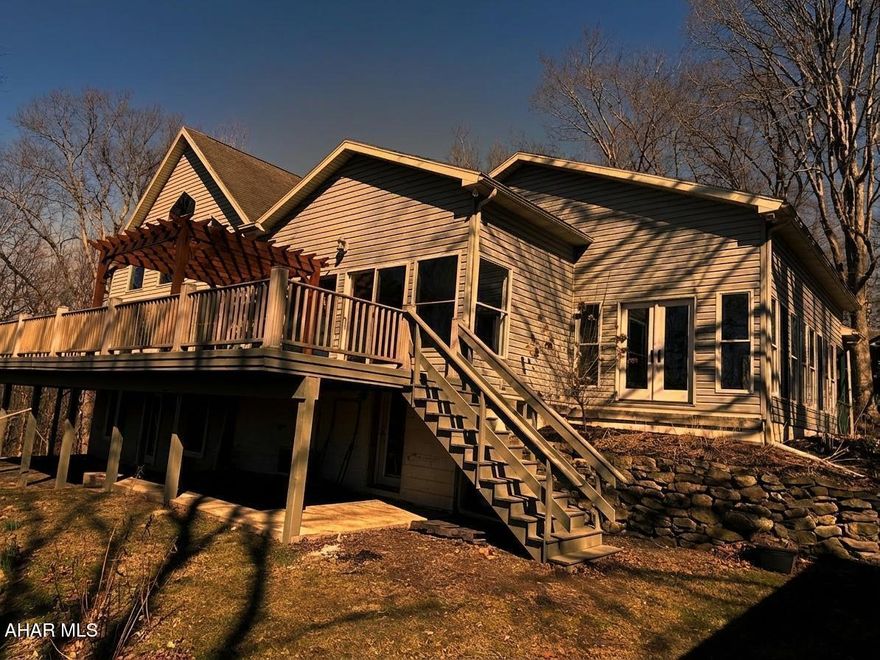 Are you looking for a private retreat? Check out this beautiful property adjacent to the American Legion Country Club in Mount Union. This quality home has a great layout with an open living area. The main living area has a living room with vaulted ceilings and a wall of windows letting in lots of natural light, and an open stairway to the second floor. The kitchen features lots of cabinet space with a walk-in pantry, island and bar area, the huge composite deck can be accessed from the living room or dining area making this the perfect spot for entertaining, the deck has a wonderful view of the river when the leaves are off the trees and lots of privacy all summer long, there is a sunroom off the kitchen, the owner suite has a large walk-in closet and full bath, the upper level offers two bedrooms with a full bath and a bonus room that could be used for an office or nursery, the lower level has two additional bedrooms with a full bath, the bedrooms all have nice sized closets, the basement opens at ground level and is mostly finished with the unfinished areas turned into closets that offer lots of storage, a laundry area and even a half bath, this home is well thought out and offers lots of space for you, your family and friends and all your belongings, call today to schedule your showing