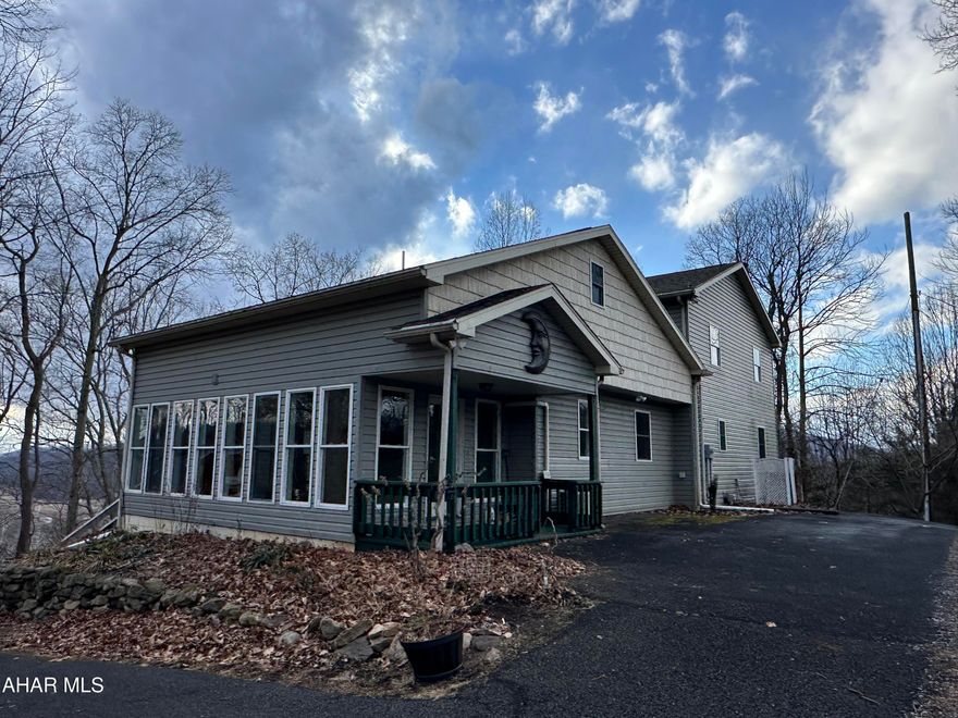 Who says you can't have it all? Check out this beautiful property adjacent to the American Legion Country Club in Mount Union. This quality home has a great layout with an open living area. The main living area has a living room with vaulted ceilings and a wall of windows letting in lots of natural light, and an open stairway to the second floor. The kitchen features lots of cabinet space with a walk-in pantry, island and bar area, the huge composite deck can be accessed from the living room or dining area making this the perfect spot for entertaining, the deck has a wonderful view of the river when the leaves are off the trees and lots of privacy all summer long, there is a sunroom off the kitchen, the owner suite has a large walk-in closet and full bath, the upper level offers two bedrooms with a full bath and a bonus room that could be used for an office or nursery, the lower level has two additional bedrooms with a full bath, the bedrooms all have nice sized closets, the basement opens at ground level and is mostly finished with the unfinished areas turned into closets that offer lots of storage, a laundry area and even a half bath, this home is well thought out and offers lots of space for you, your family and friends and all your belongings, call today to schedule your showing