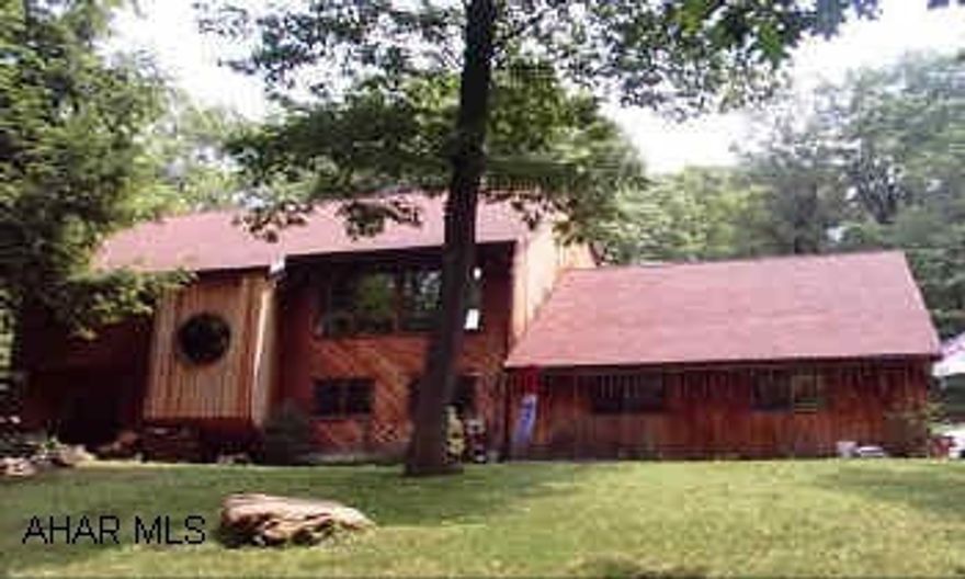 GORGEOUS, PRIVATE, WOODED SETTING 3 BR 2 FULL 2 HALF BA.  BEAUTIFULLY FINISHED STREAM RUNS THROUGH PROPERTY MUST SEE - YOUR OWN PRIVATE RETREAT. THIS PROPERTY IS SURROUNDED BY 200 ACRES OF STATE GAME LANDS.