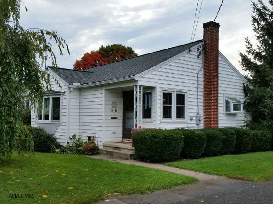 Vinyl-sided 3-bedroom rancher with hardwood floors, 1-year-old heat pump, central air, backup oil heat, updated kitchen + bath with ceramic tile flooring, + 2-year-old roof on nice street one block to park. J-312