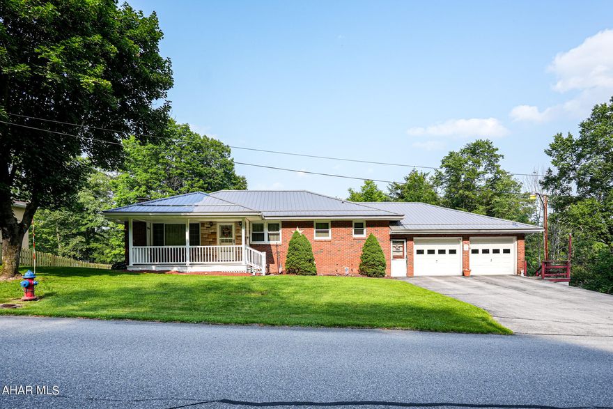 This lovely 4-Bedroom ranch home in the Central Cambria School District has many amentities, including a finished walk-out basement. The large eat-in kitchen is sure to please with abundant cabinetry, lighting and newer appliances. Features a first floor laundry room with a 3/4 bath, plus a full bath near the bedrooms.  Windows are updated  with the tilt-in feature for ease of cleaning. This home also has three heat sources; oil hot water baseboard, electric baseboard and mini-split. Plus, keep cool on hot days with the mini-split A/C!  The basement is finished with a bedroom, den area, utility room, two extra bonus rooms, half bath, and new walk-out sliding glass door.  The house is wired for a generator in the event of a power outage, and all you need is the generator! In addition, never run out of hot water with the REA installed water tank.  The outside features a new front porch with boat decking, newer metal roof, and 2 sheds, all on 1.3 acres. Large garage with ample space with heat source. To top it off, the home borders the Ghost Town Trail and is close to shopping areas and restaurants! This is a one owner home.