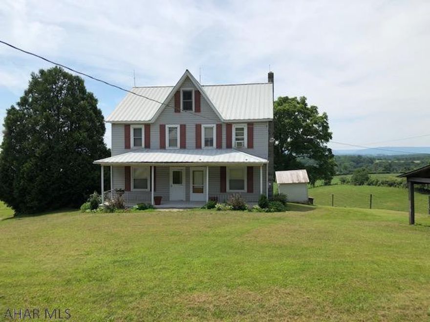 Absolutely lovely country setting with a 4 bedroom, 1 full bath home with additional  bath in basement  on 10 acres.  This property has numerous outbuildings and a large barn.   The house is well maintained with large rooms.  Small pond and stream on the property.  Close to I-70 and the turnpike.  Tons of uses with all the buildings and the grounds.  Fantastic view.  The home has all the plumbing run for an outdoor wood burner but would need to install the wood burner.