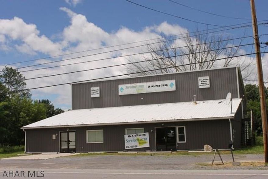 Large Commercial building with offices, reception area, and kitchen. Warehouse is equipped with 18' garage door and access to 2nd floor storage area. Great visibility and located right off I-99 Bellwood exit. Plenty of parking. Call listing agent.