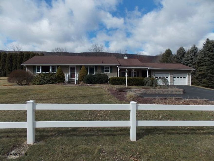 Spotless country home on a  beautifully landscaped lot. Maintenance free exterior with new siding windows, soffit, fascia and fence. The private deck is a great place to cook out this summer while the kids play in the .9 acre yard. The hardwood floors are beautiful and the kitchen and bath have been updated. Dad will love the huge basement and large 2 car garage as well as the 2 storage sheds. If you like county living this home is a must see!