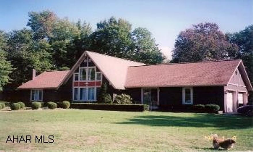 1.5 Story home on 8.8 beautiful wooded acres. Secluded and peaceful. Pavilion for those family picnics. 2BR/1BA, loft overlooking large living room.