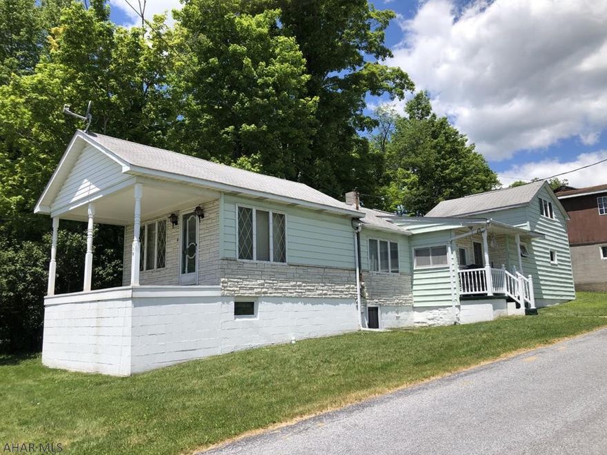 Cape Cod 3 BR, 1 1/2 bath home on 1/2 acre lot. Shop with 4 bay commercial garage containing 3,792 Sq ft. Was formerly a wood cabinet shop.