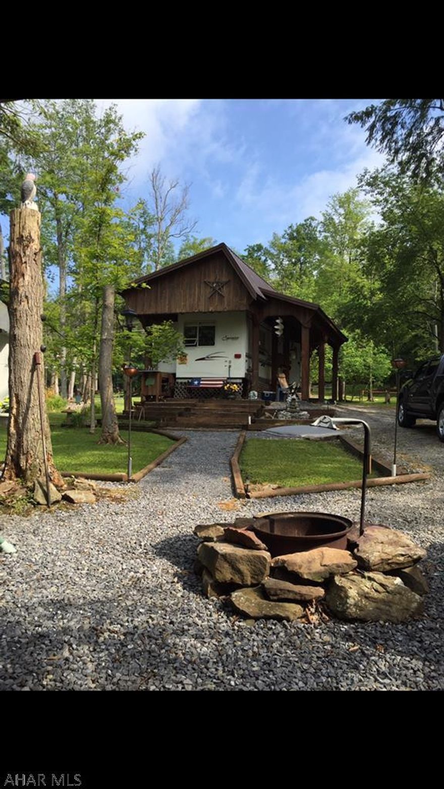 Too much to list.  Immaculately upkept camp site featuring pavilion built over camper, metal awning with wood floor, deck area, storage shed with fridge.  Call for more details or to schedule a showing.