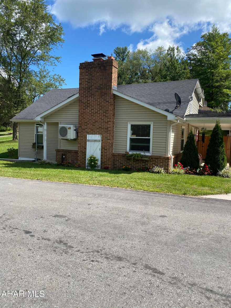 Escape to your own private heaven just beyond the city's reach, where this remarkable property awaits. Situated on a fenced lot, this real estate gem boasts a convenient two-car garage with a versatile space above, perfect for transforming into your dream retreat or workspace. A serene fishing stream flows just across the street. This secluded location provides the ultimate in privacy, allowing you to unwind and reconnect with nature in your own tranquil oasis. Inside you'll find open living spaces filled with natural light. The first floor offers a bedroom or office and a full bathroom, and laundry is located on the second floor for added convenience.  The roof, siding, and windows are all newer along with a newly updated interior so all you have to do is enjoy this home! With its blend of modern convenience and natural beauty, this property offers a unique opportunity to live the best of both worlds. Schedule a viewing today.